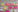 A whiteboard with post-it notes from the workshop breakout sessions