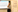 A man stands in front of an electronic whiteboard giving a presentation and looking thoughtful